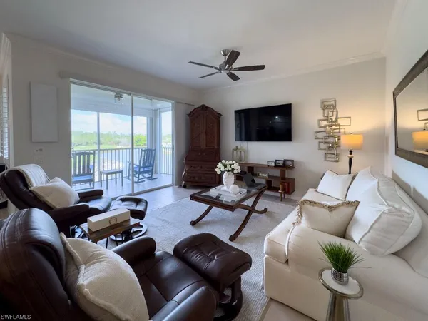 a work room with furniture and a flat screen tv