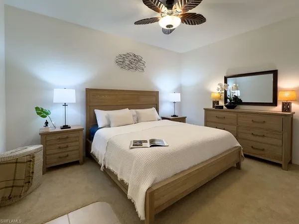 a bathroom with a toilet a sink and a mirror