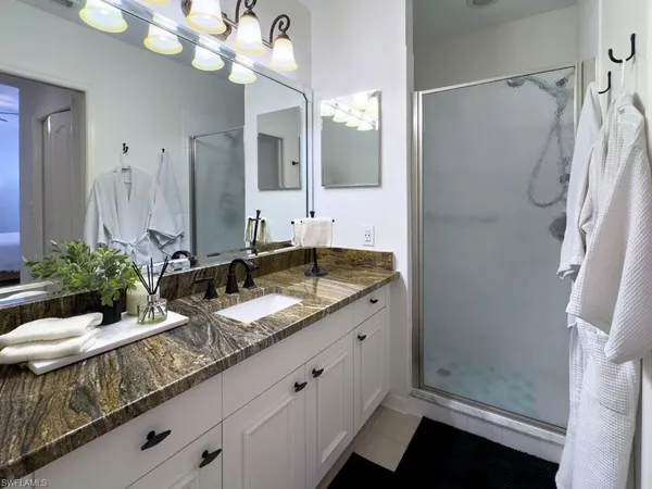 a view of a swimming pool with a lounge chair