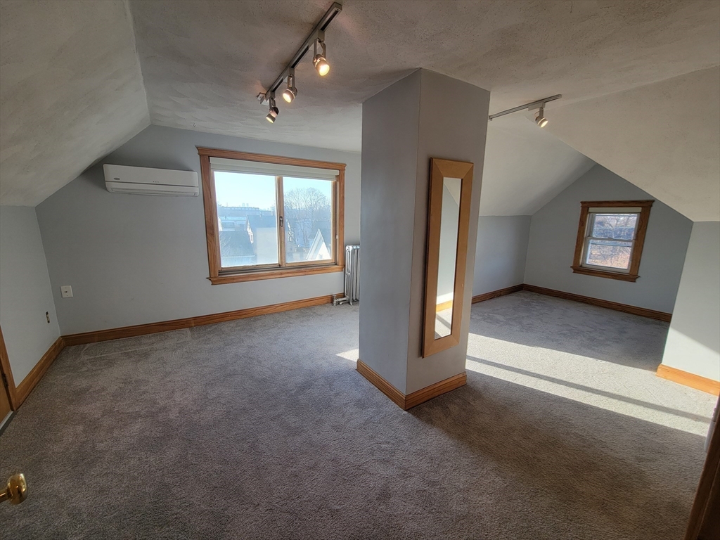 100 Medford Street, Unit 2 Malden, MA 02148 - Photo 21 of 29 an empty room with windows and closet