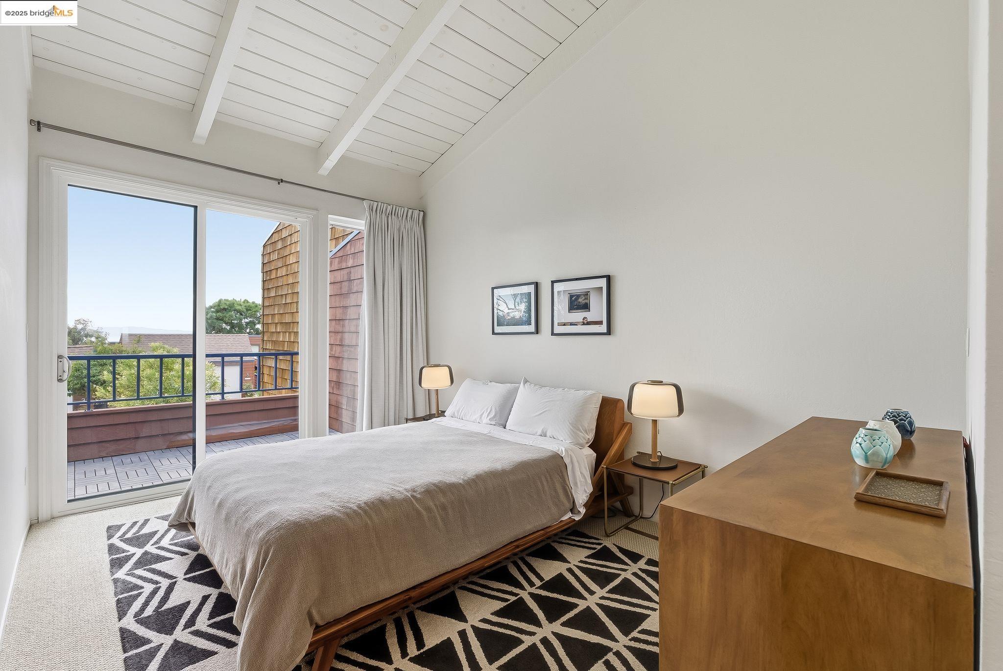 2 Sereno Circle Oakland, CA 94619 - Photo 15 of 42 a bedroom with a bed and a table