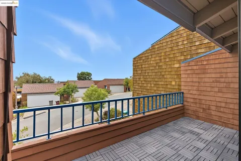 a bedroom with a bed and cabinets