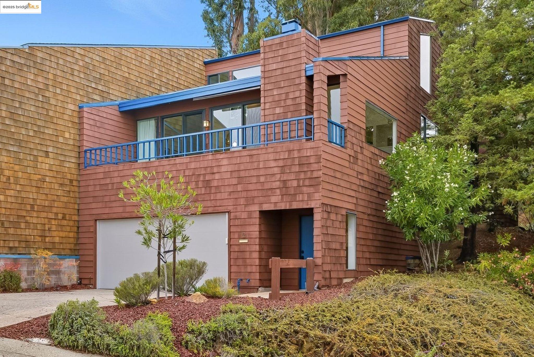 2 Sereno Circle Oakland, CA 94619 - Photo 2 of 42 a front view of a house with garden