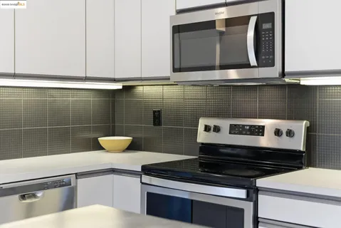 a kitchen with a table and chairs