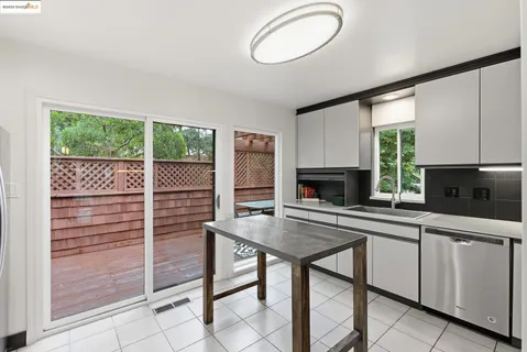 a view of a backyard with sitting area