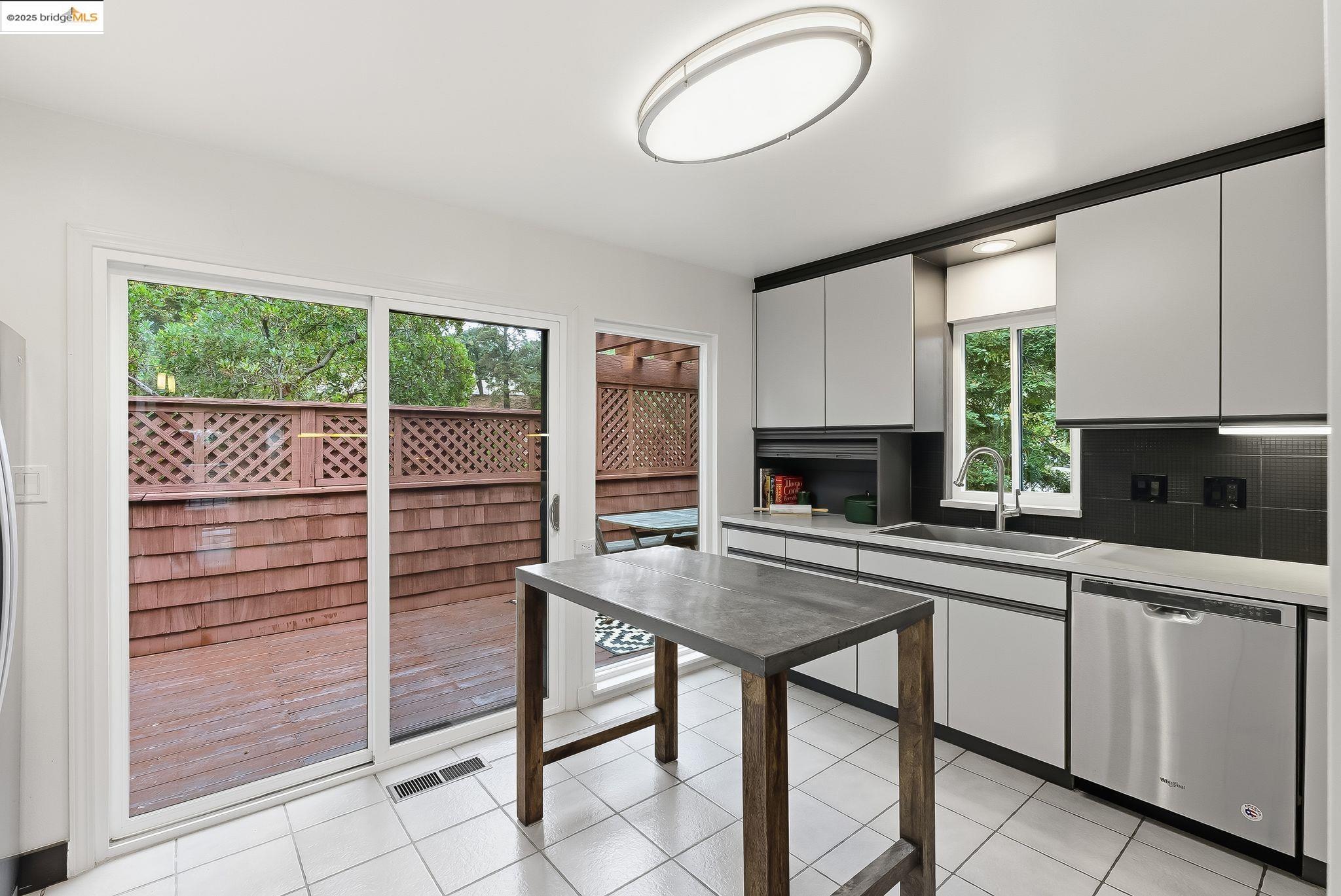 2 Sereno Circle Oakland, CA 94619 - Photo 26 of 42 a kitchen with a table and chairs