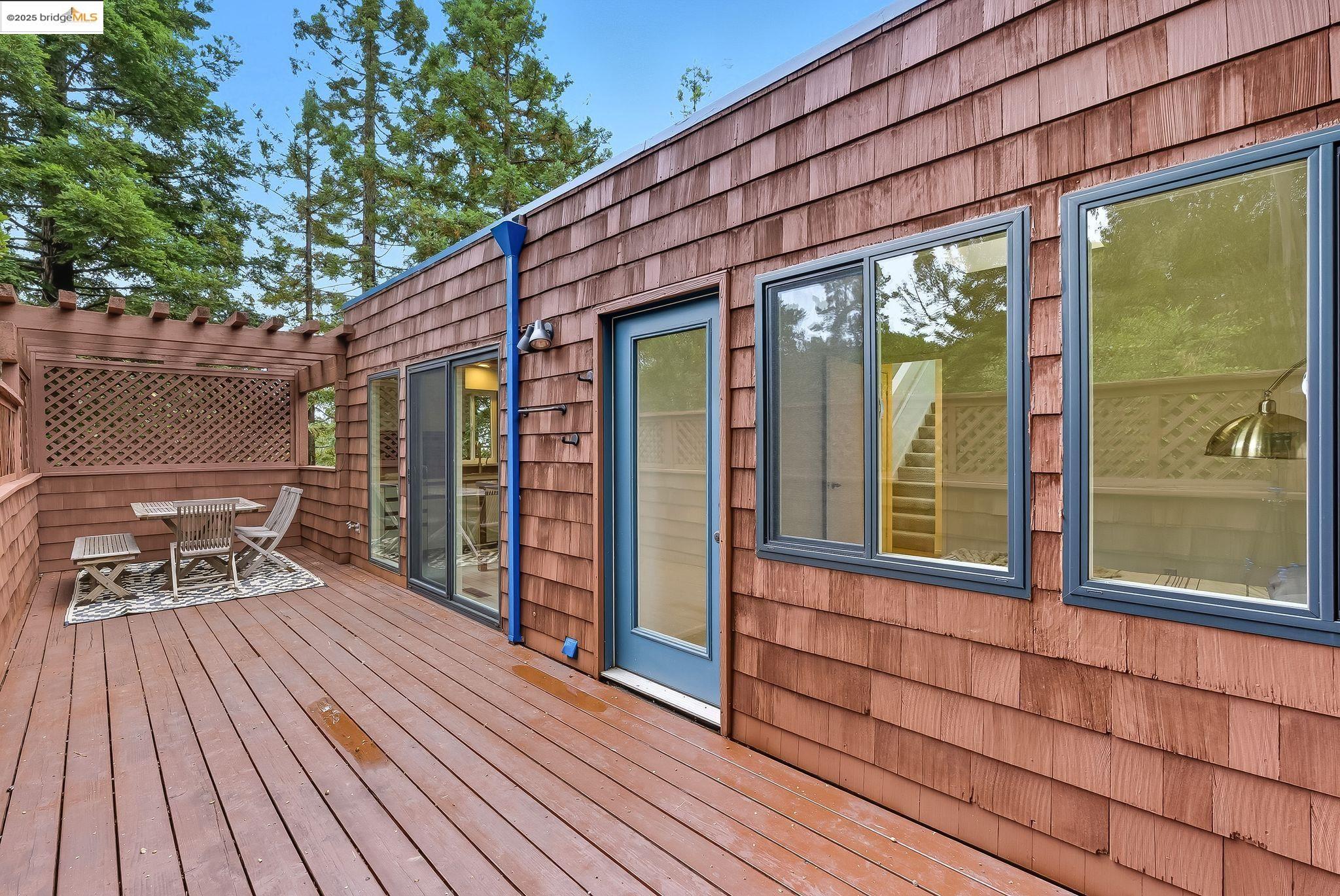 2 Sereno Circle Oakland, CA 94619 - Photo 27 of 42 a view of a wooden deck with a yard