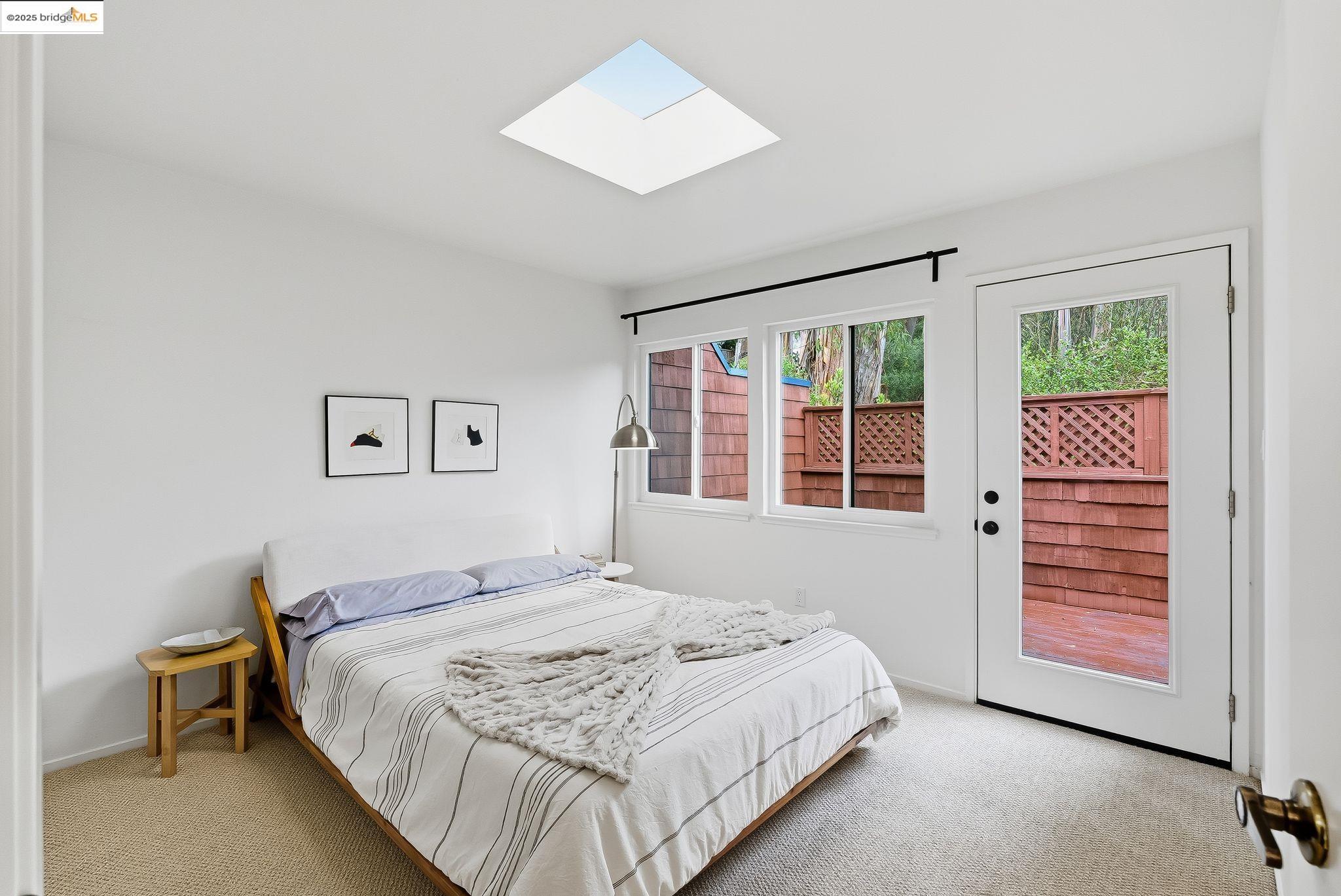 2 Sereno Circle Oakland, CA 94619 - Photo 29 of 42 a bedroom with a large bed and a window