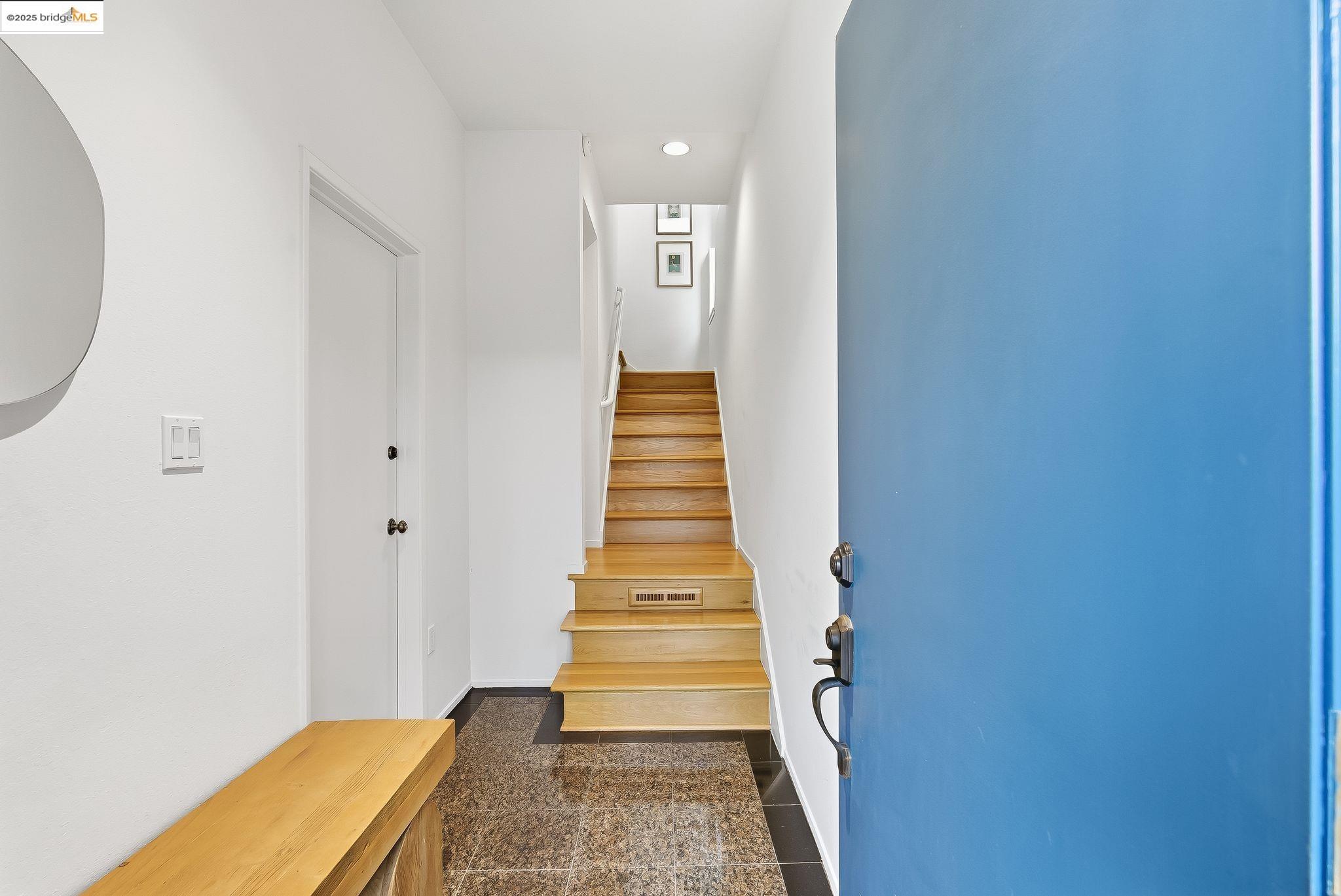 2 Sereno Circle Oakland, CA 94619 - Photo 5 of 42 a view of a hallway with wooden floor and staircase