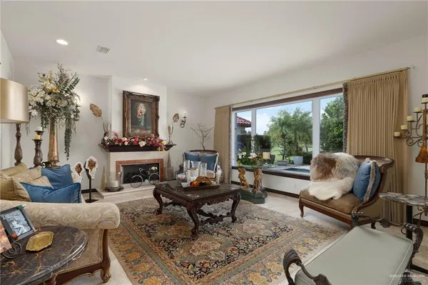 a living room with furniture and a large window