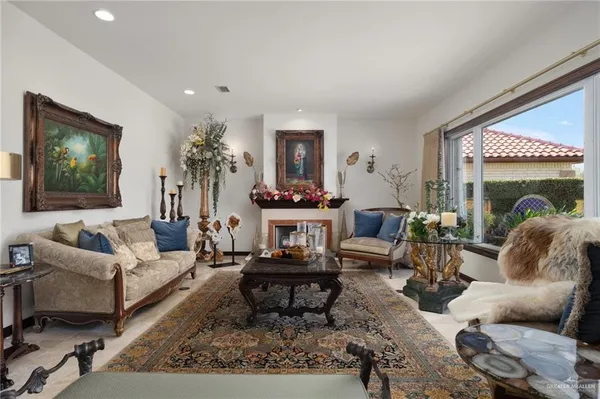 a living room with furniture and a large window