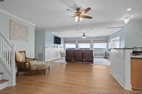 a living room with furniture and a rug