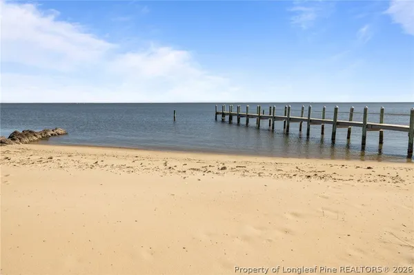 a kitchen with stainless steel appliances granite countertop a refrigerator and a stove