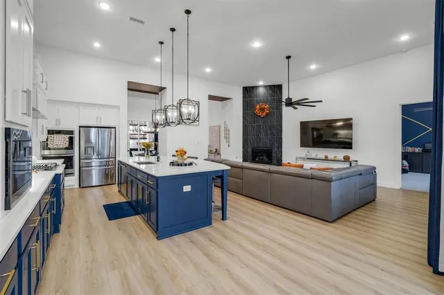 a bedroom with bed and a wooden floor