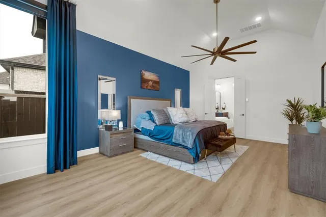a spacious bathroom with a double vanity sink a mirror and shower