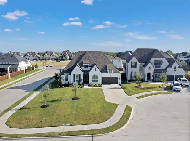 a view of a house with outdoor space and sitting area