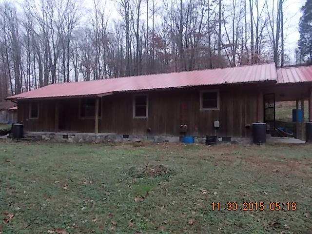 671 Tucker Road Lafayette, TN 37083 - Photo 1 of 20 a view of a house with a yard and tree