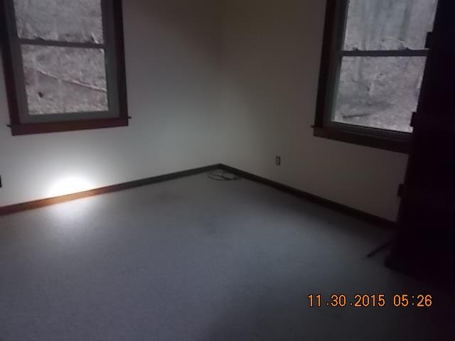 671 Tucker Road Lafayette, TN 37083 - Photo 14 of 20 a view of a room with wooden floor and windows