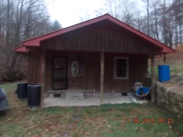 671 Tucker Road Lafayette, TN 37083 - Photo 8 of 20 a backyard of a house with seating space