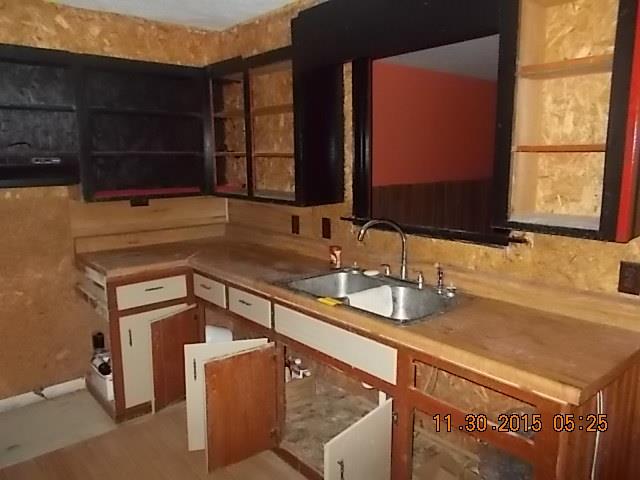 671 Tucker Road Lafayette, TN 37083 - Photo 10 of 20 a bathroom with a sink and a mirror