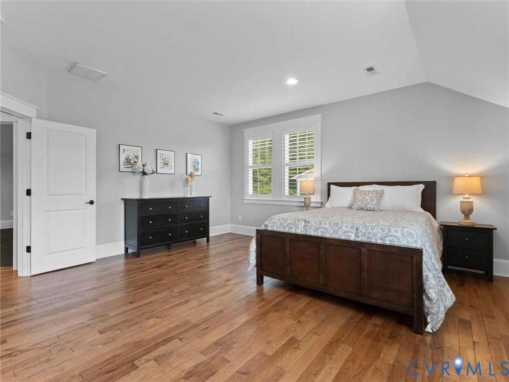 1925 Limbeck Lane Midlothian, VA 23112 - Photo 59 of 89 a spacious bedroom with a bed and a flat screen tv
