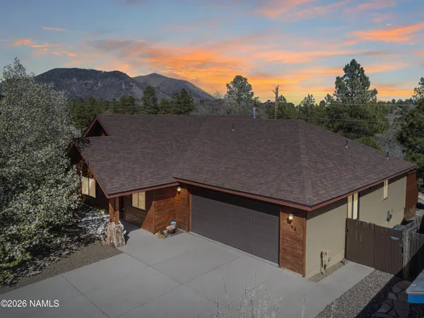 a view of a dining room with furniture and window