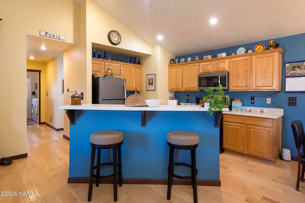 a bathroom with a sink a toilet and shower curtain