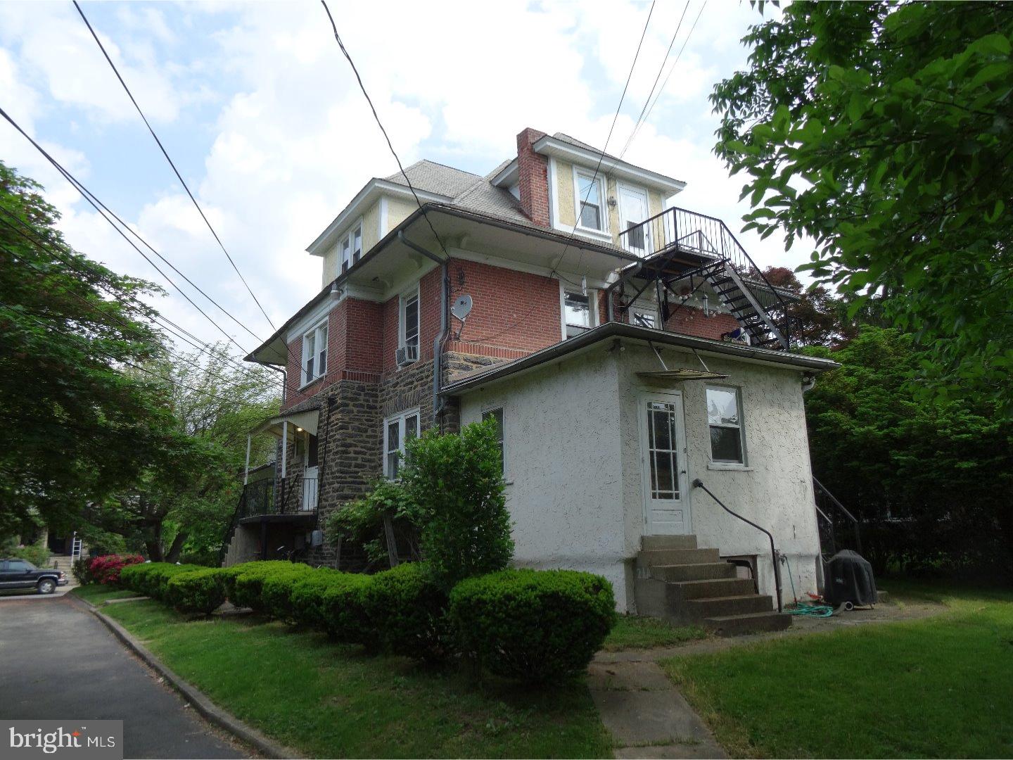 21 Tenby Road Havertown, PA 19083 - Photo 4 of 21 a house that has a lot of windows and trees in the background