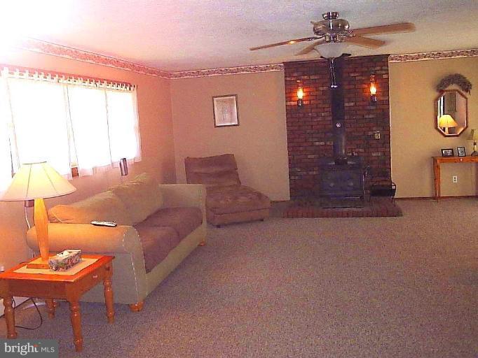 14 Geranium Place Middle River, MD 21220 - Photo 14 of 20 a living room with furniture a lamp and a window