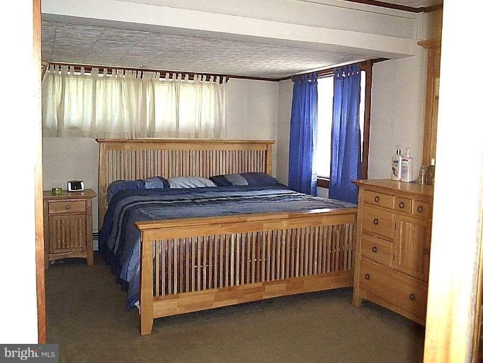 14 Geranium Place Middle River, MD 21220 - Photo 3 of 20 a bed sitting in a spacious bedroom next to a window