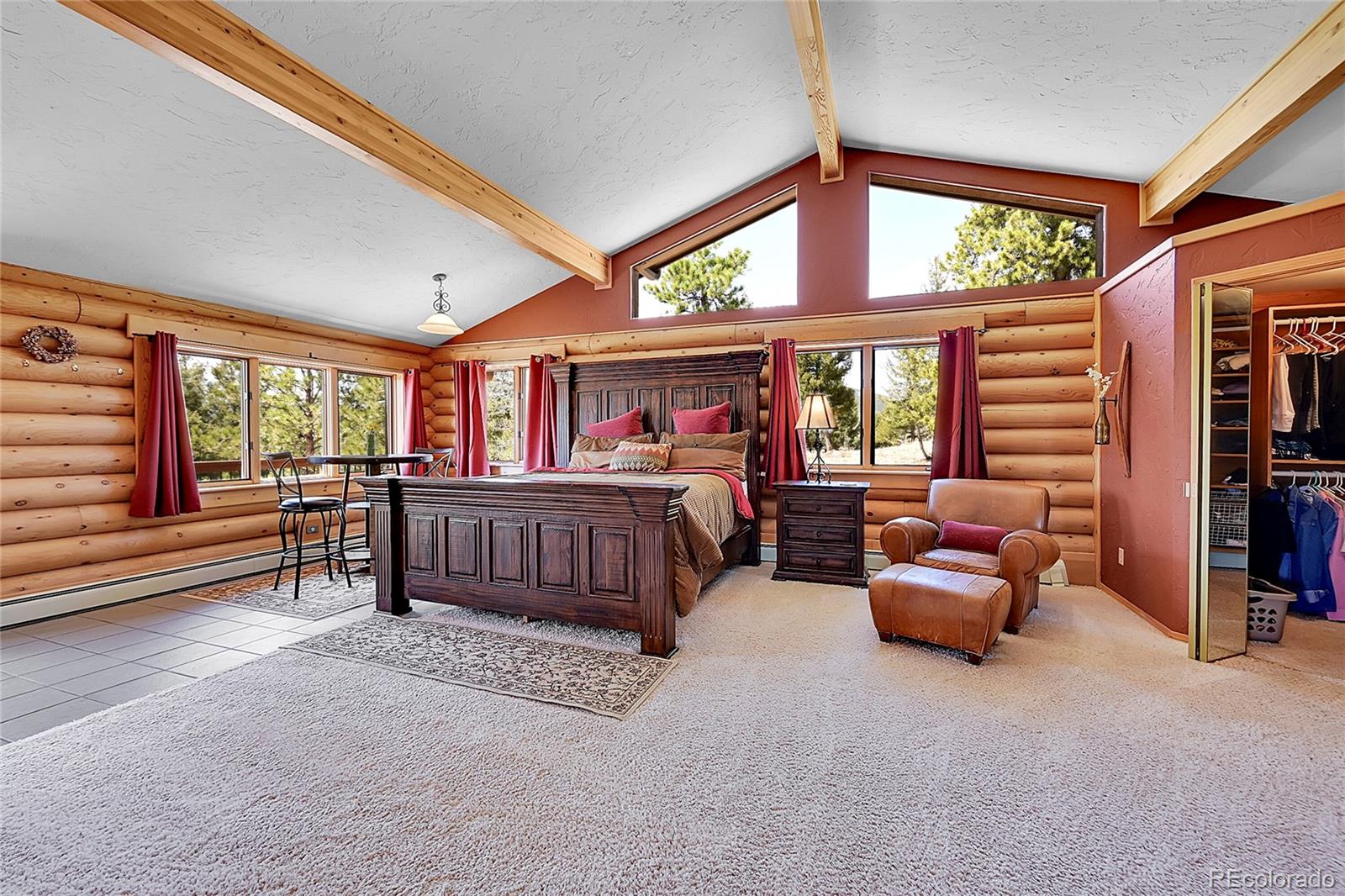 1392 Tapadero Road Bailey, CO 80421 - Photo 15 of 50 a bedroom with furniture and a large window