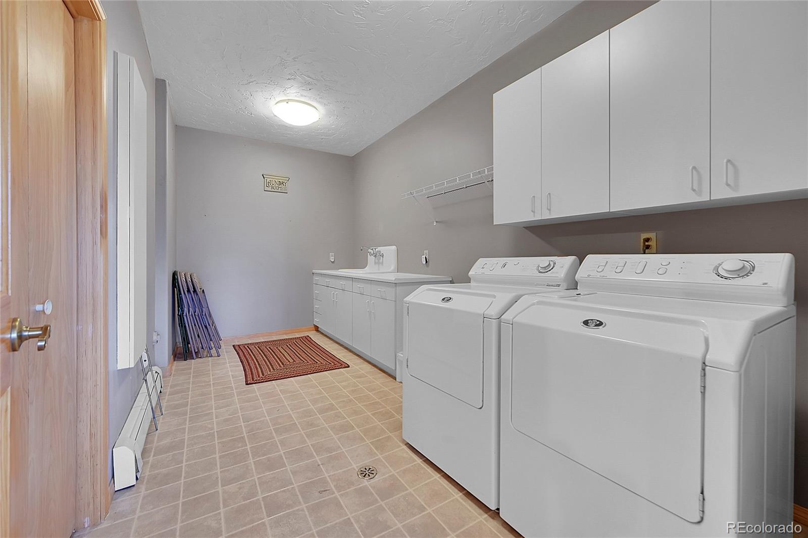 1392 Tapadero Road Bailey, CO 80421 - Photo 29 of 50 a utility room with dryer and washer