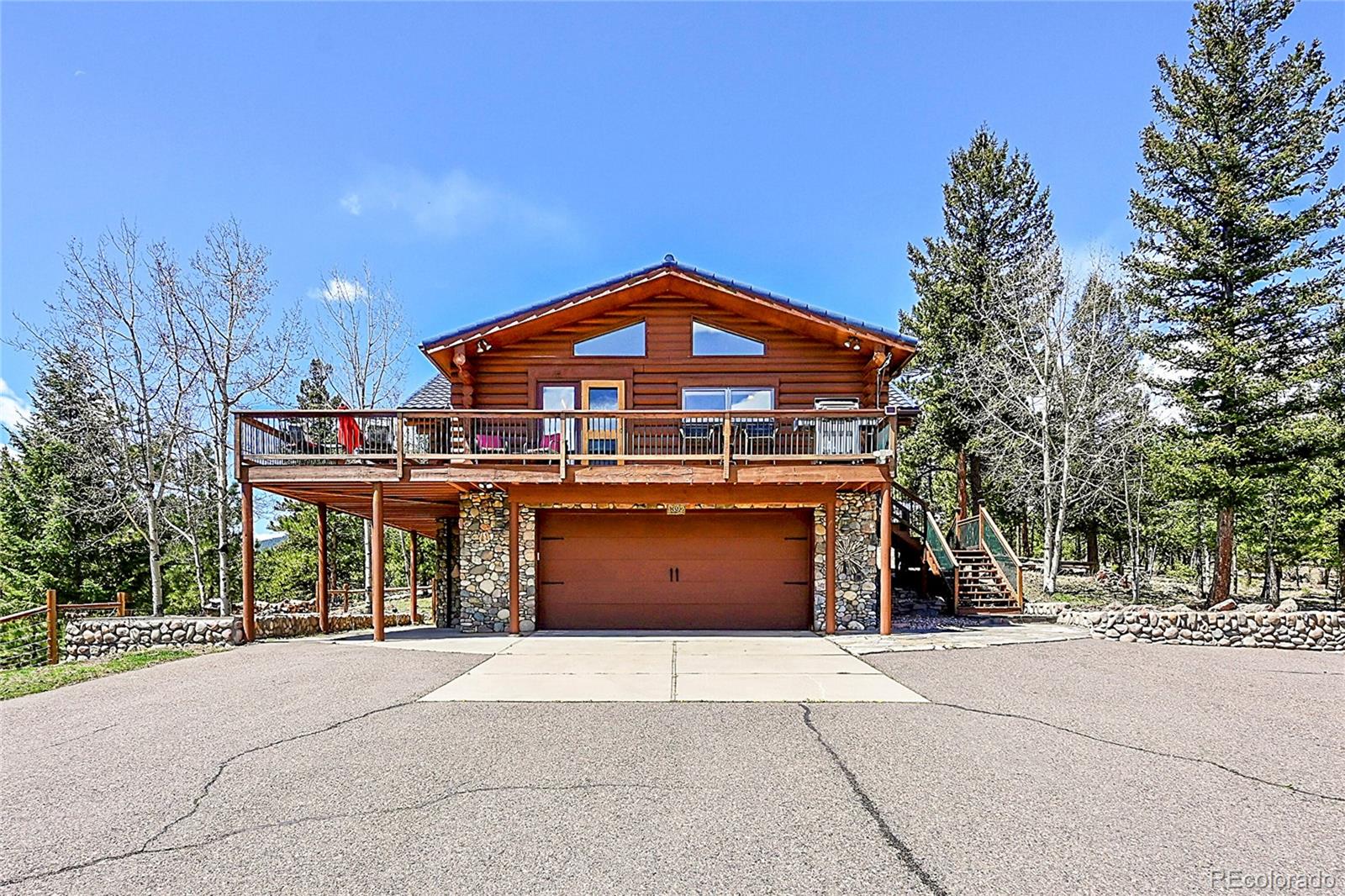 1392 Tapadero Road Bailey, CO 80421 - Photo 3 of 50 a front view of a house with a yard