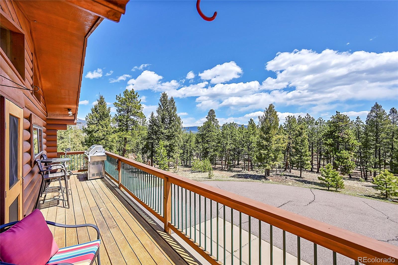 1392 Tapadero Road Bailey, CO 80421 - Photo 32 of 50 a view of a balcony with wooden floor