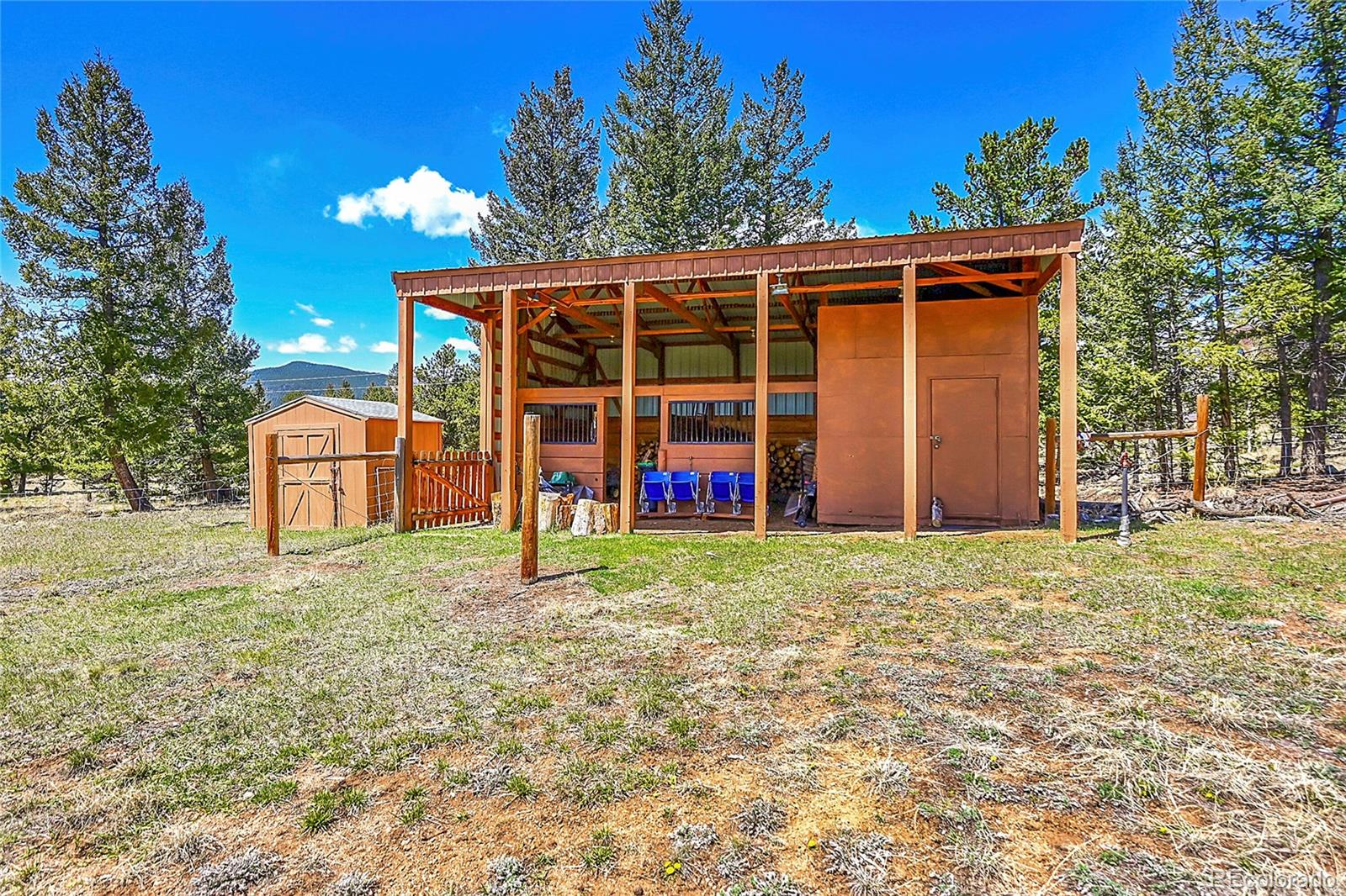 1392 Tapadero Road Bailey, CO 80421 - Photo 36 of 50 a view of a house with backyard and porch