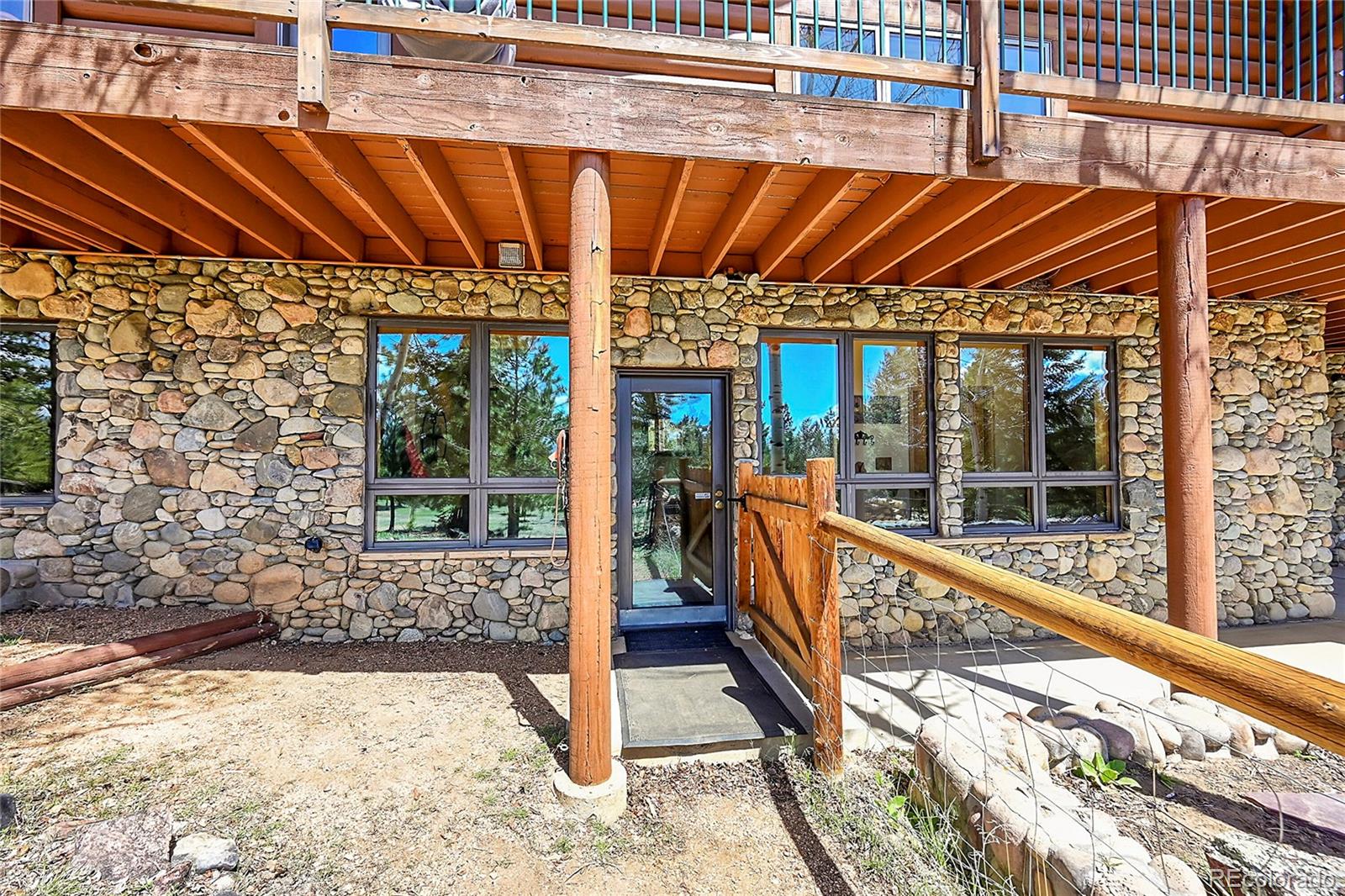 1392 Tapadero Road Bailey, CO 80421 - Photo 39 of 50 a view of swimming pool with a patio