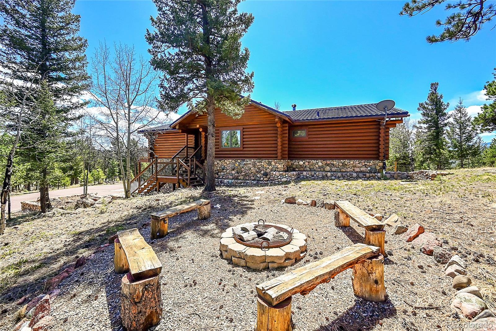 1392 Tapadero Road Bailey, CO 80421 - Photo 40 of 50 a view of a backyard with a patio