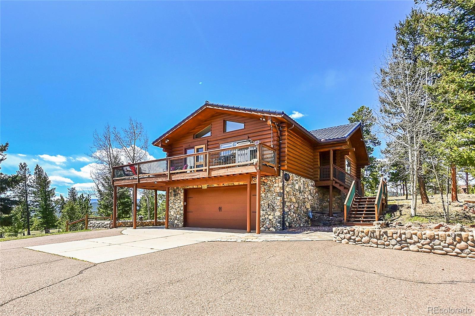 1392 Tapadero Road Bailey, CO 80421 - Photo 4 of 50 a front view of a house with a yard
