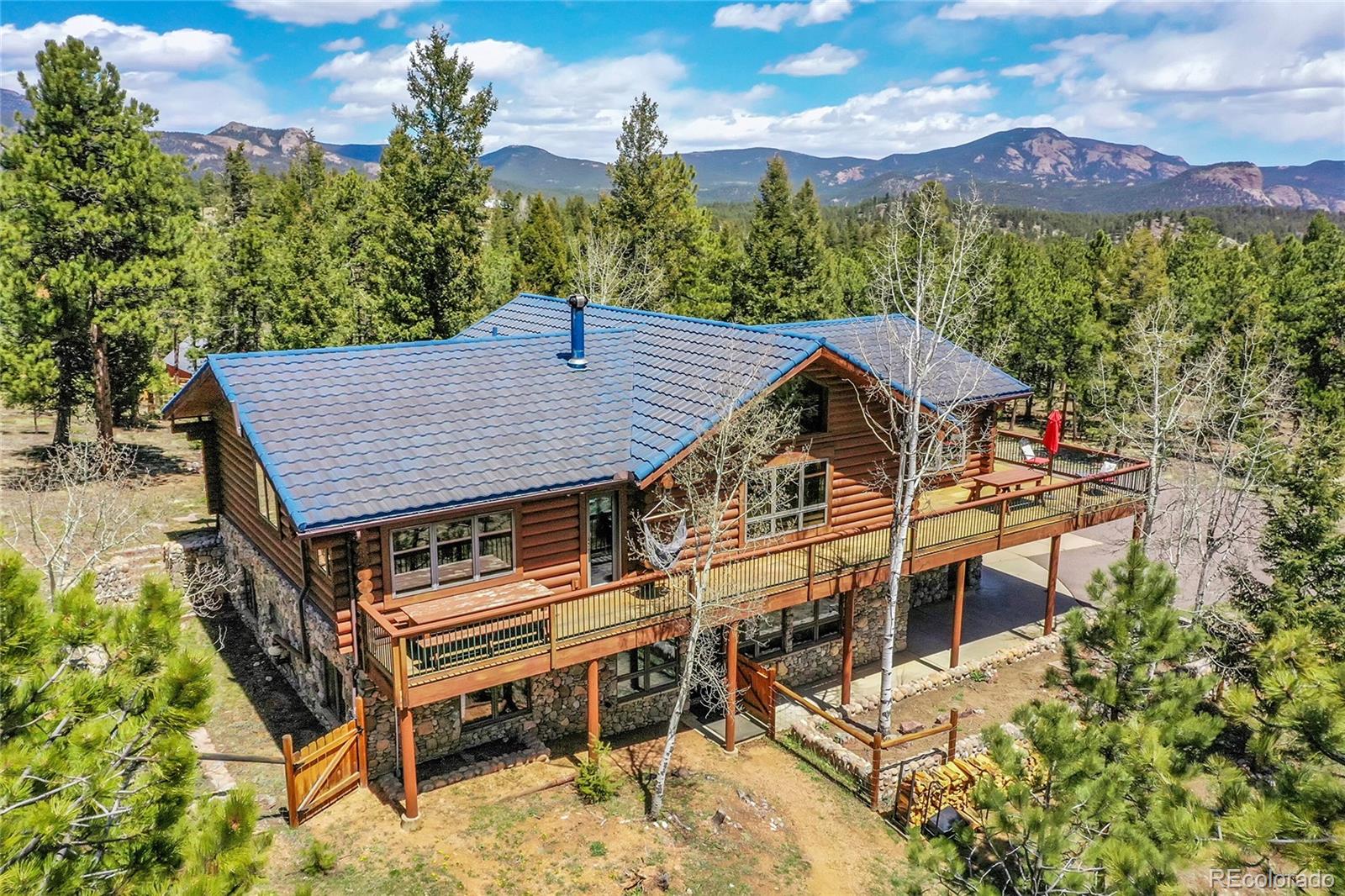 1392 Tapadero Road Bailey, CO 80421 - Photo 43 of 50 a view of a chairs and table on the terrace