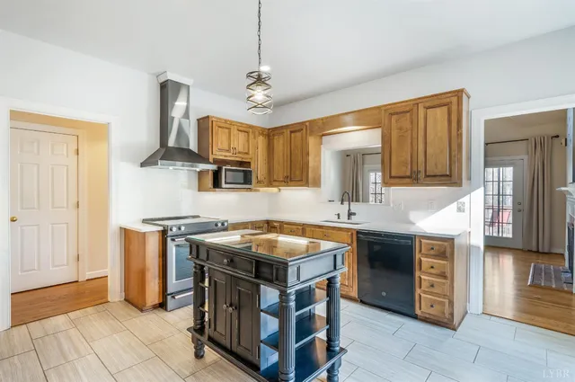 a view of empty room with wooden floor and fireplace