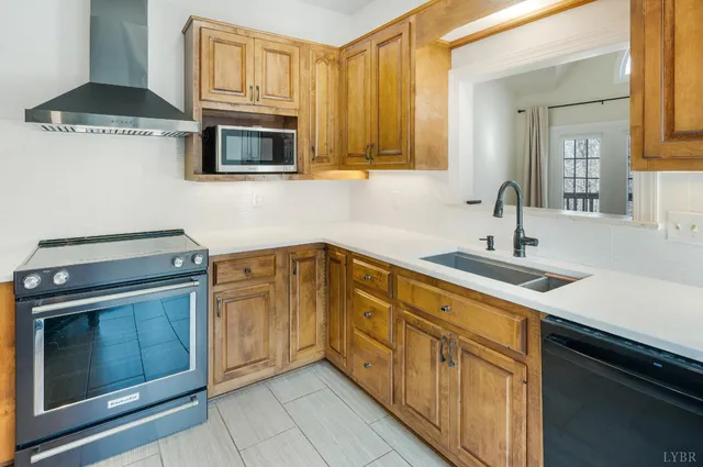 a view of a room with wooden floor and white walls