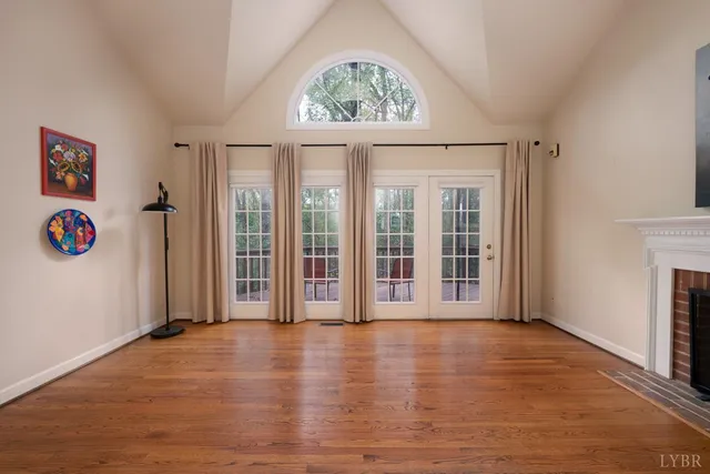 a view of a room with wooden floor