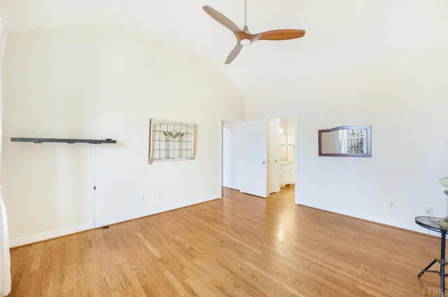 a bathroom with a shower curtain and a window