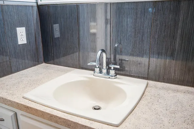 a view of an room with wooden floor and staircase