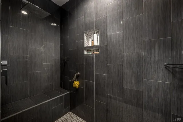 a wooden bench sitting in front of a door