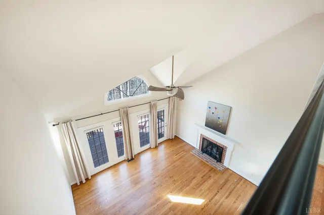 a front view of a house with balcony and garden
