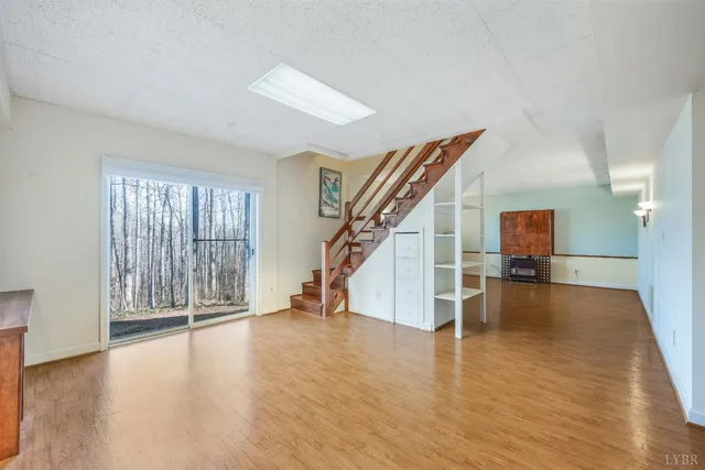 a bed room with a bed and a chair