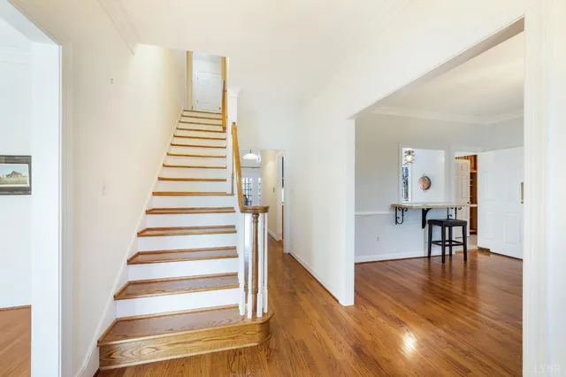 a kitchen with stainless steel appliances granite countertop a stove top oven a sink and a refrigerator