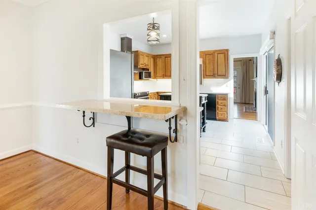 a very nice looking room with a large window and chandelier