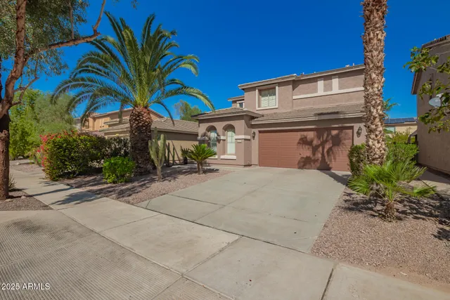 a front view of a house with a garage